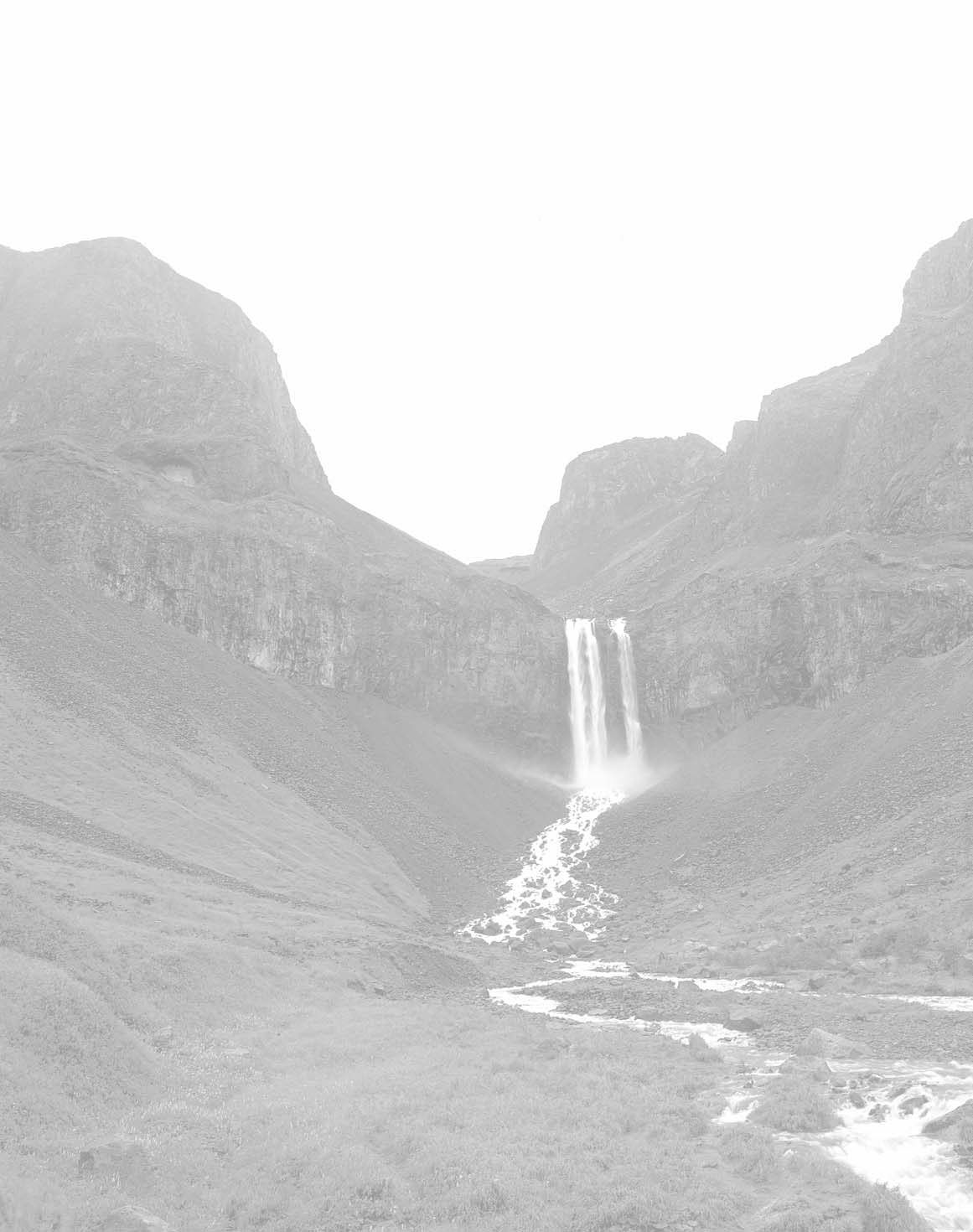 A waterfall between rocky hills