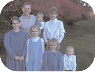 The Costanza family outdoors.