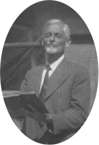 Portrait of Herbert Grings holding an open book