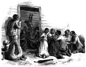 People kneeling together beside a wooden doorway