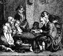 A family gathered around a table while a man reads.