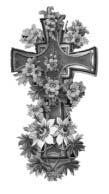 An ornate cross surrounded by flowers.