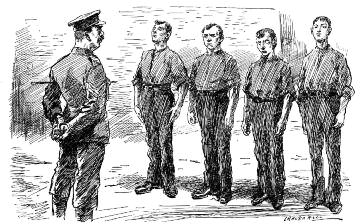 An officer standing before four uniformed men