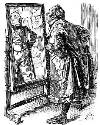 A man looking at himself in a tall mirror