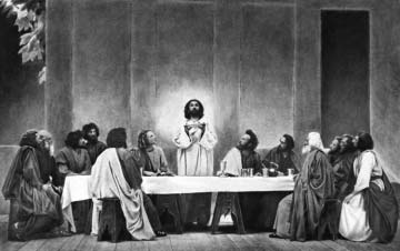 Jesus and the disciples gathered around a table.
