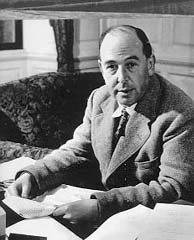 C. S. Lewis seated with a book