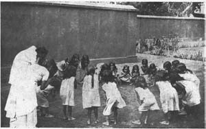 A group of rescued girls playing a game outdoors