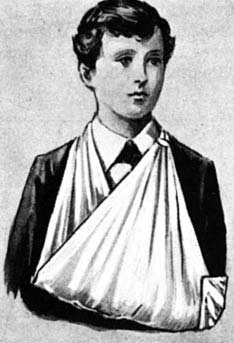 A boy with his arm supported in a sling