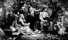 Jesus teaching a seated group outdoors.