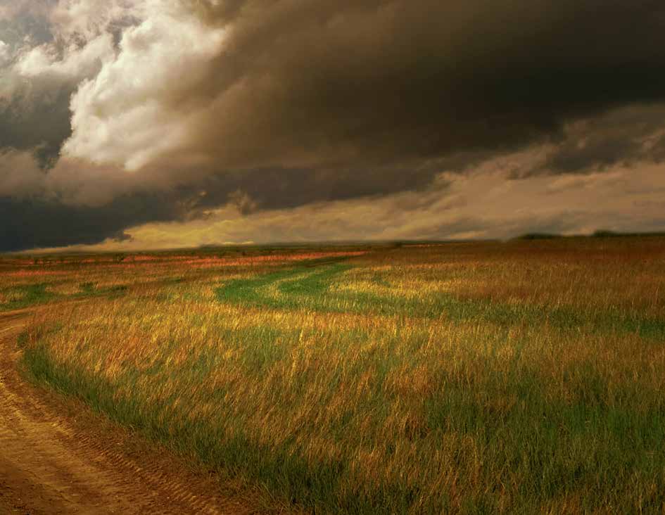 Storm clouds over a prairie, right half of a two-page photograph
