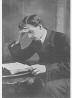 Small illustration of a man reading at a desk