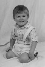 Nathanael seated for a portrait.