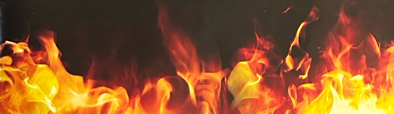 Bright yellow and orange flames against a dark background.