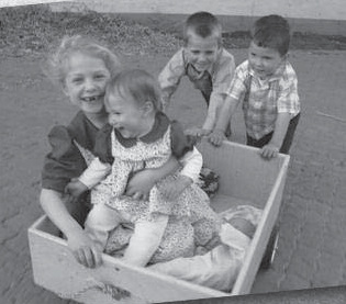 Four children in a small cart