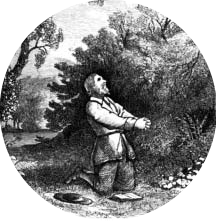 A man kneeling in prayer among trees.