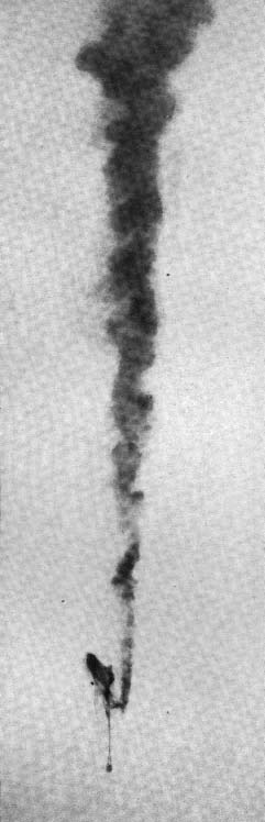 An aircraft falling with a trail of smoke