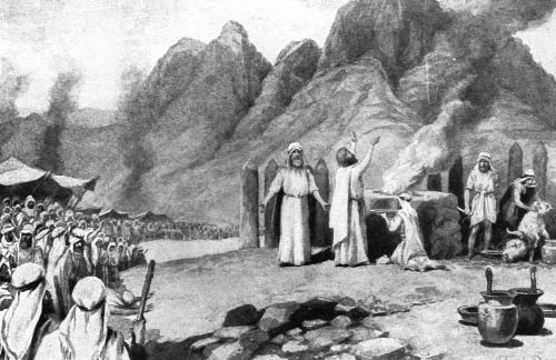 An assembly watches men performing a sacrifice before mountains