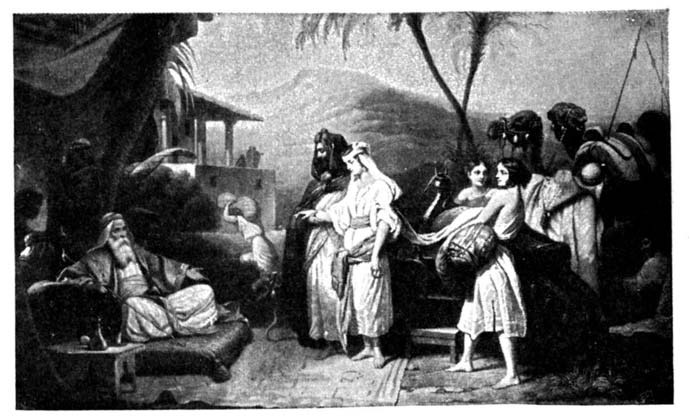A seated elderly man facing a family group