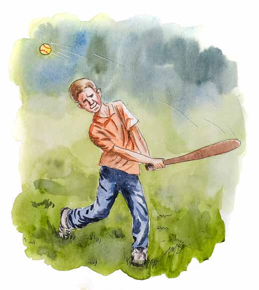 A boy swinging a baseball bat