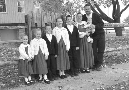 Dean Taylor and his family standing outdoors