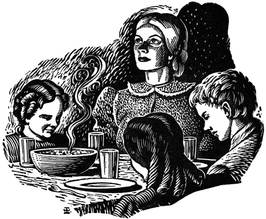 Mother and children seated around a table with bowed heads