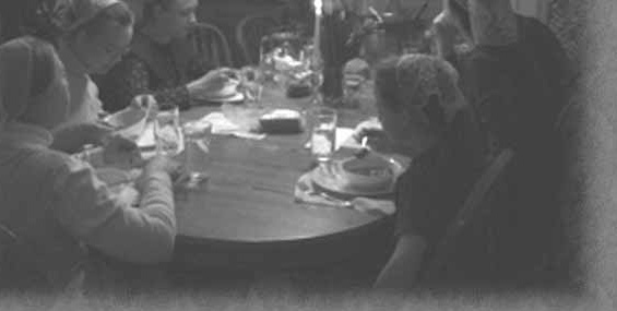 Family members seated around a dining table