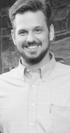 portrait of a smiling bearded man