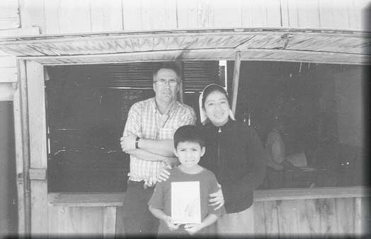 Chris Armstrong with Angélica and Enrique outside their chapel