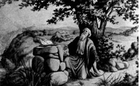A man kneeling beside a stone altar beneath a tree.