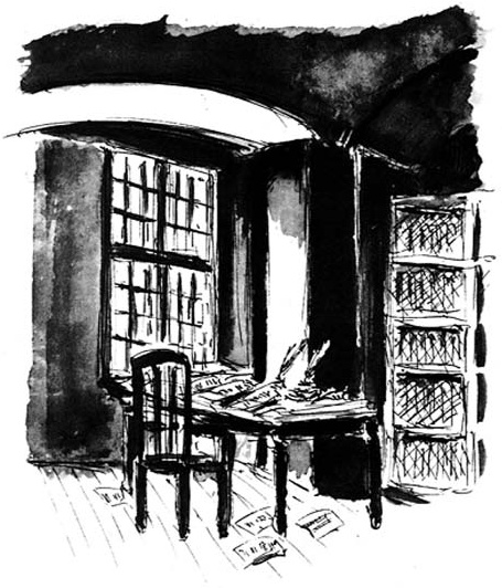 Writing desk and chair beside a window.