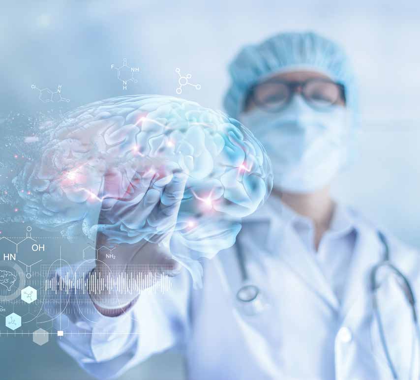 A doctor beside a medical illustration of a human brain