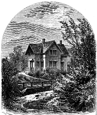A house beside a stream and a small bridge