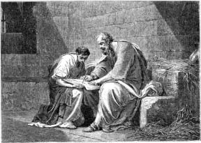 Two seated men examining an open book