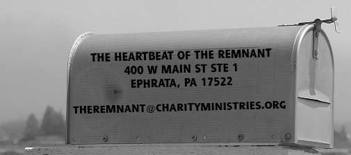 A roadside mailbox bearing the magazine name and contact details