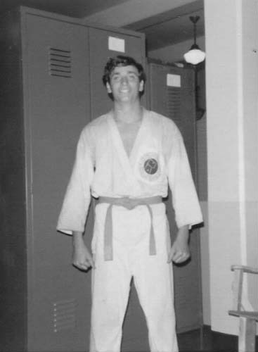 A young man wearing a martial arts uniform