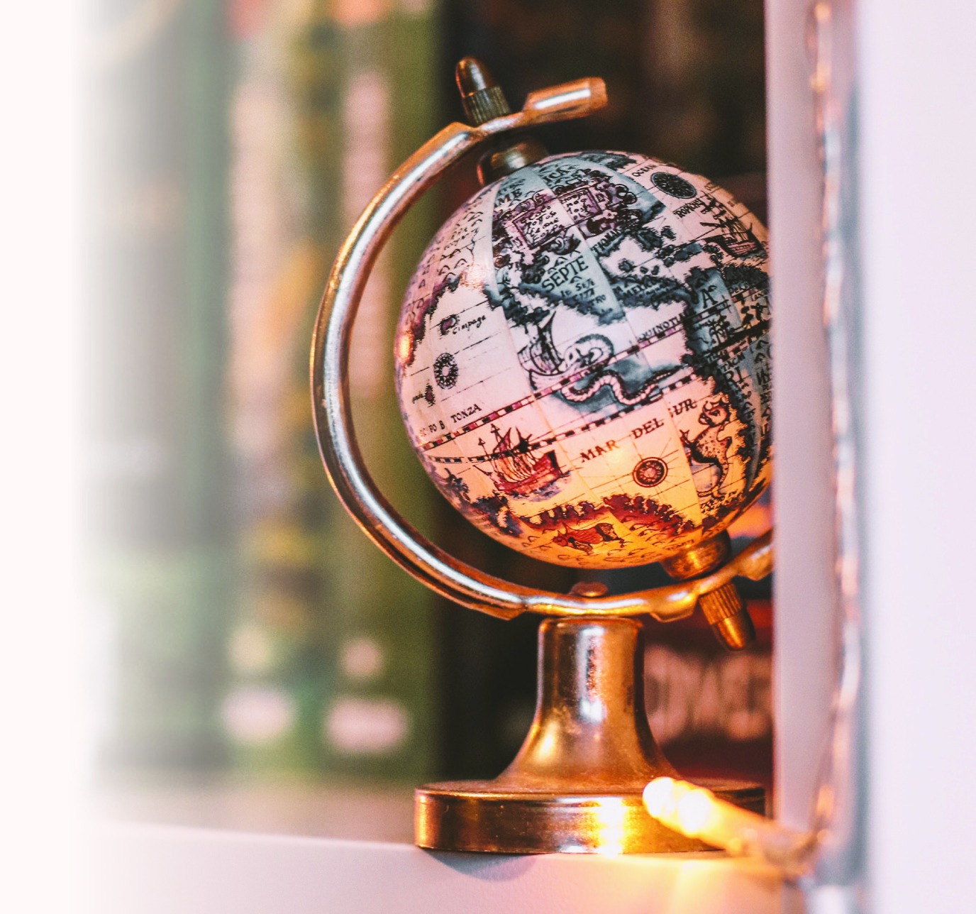 A decorative globe lit by warm sunlight