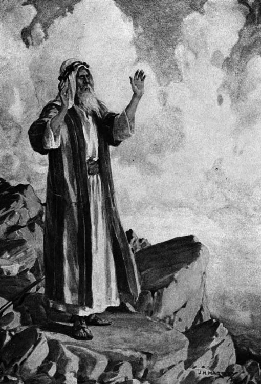 Moses stands on a rocky height with one hand raised