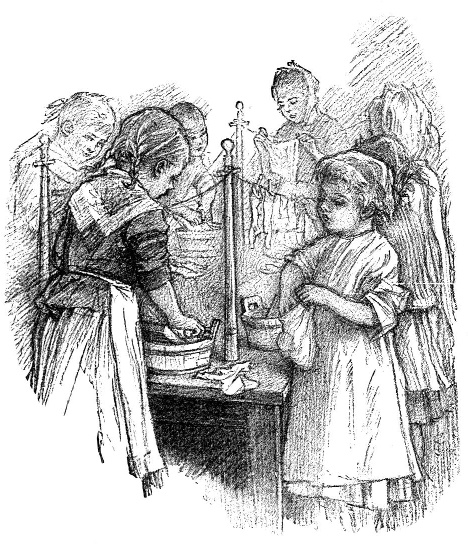Children work together at a table with a balance scale