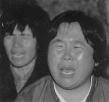 Two women with their eyes closed