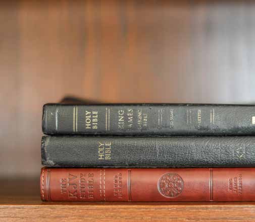A stack of old Bibles and books