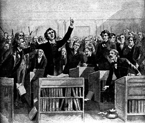 A man addressing a crowded assembly