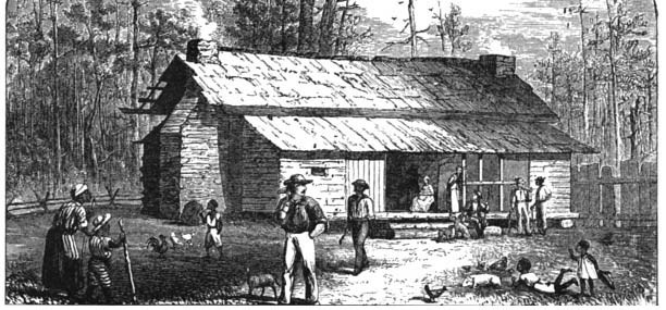 People outside a wooden cabin