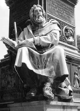 Statue of Peter Waldo seated with an open book