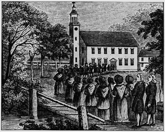 People gathering beside a church