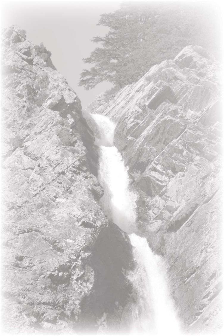 A waterfall cascading between steep rocky slopes