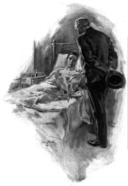A man holding a hat stands beside a patient lying in bed.